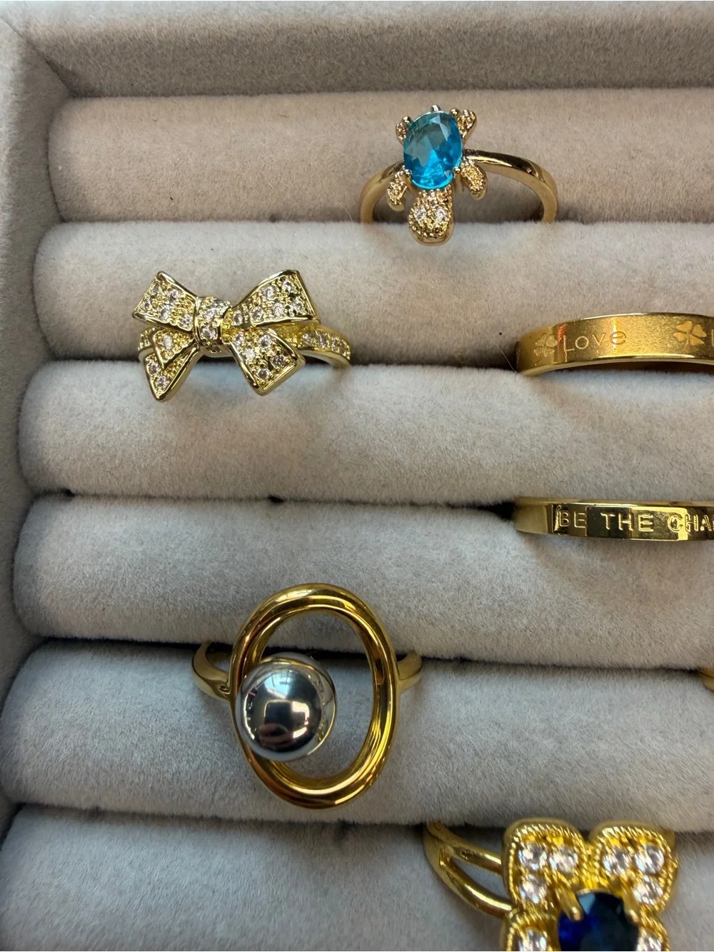 Lot of Eight Gold Tone Rings-Unbranded